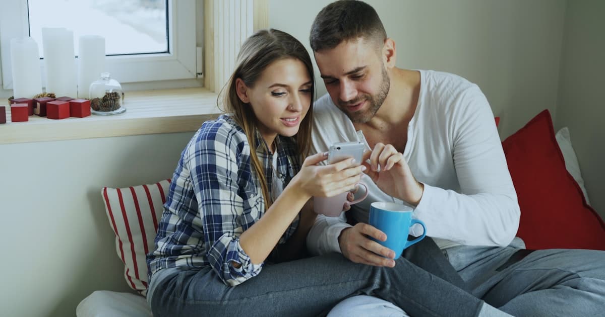 Couple looking at a smartphone together